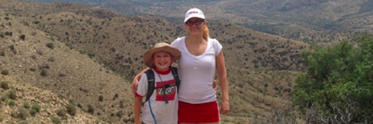 How to Parent With Bipolar Disorder mother and son posing on mountain peak