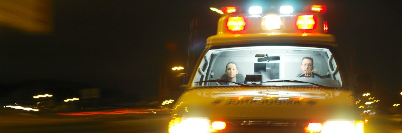 an ambulance rushing with its lights flashing