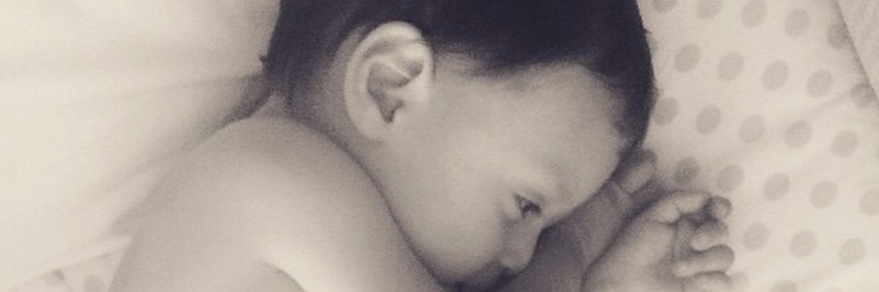 The Waiting Game of Having a Rare Disease Like Pelizaeus-Merzbacher baby in bed