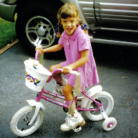 Amelia riding her bike.