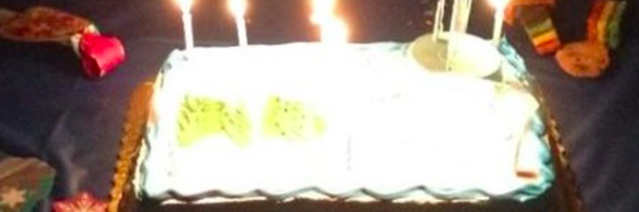 Birthday cake with birthday candles lit