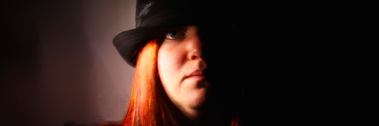 Bipolar Poem: What It's Like to Live With Bipolar Disorder the author in a hat