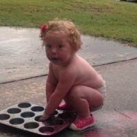 baby playing with chalk