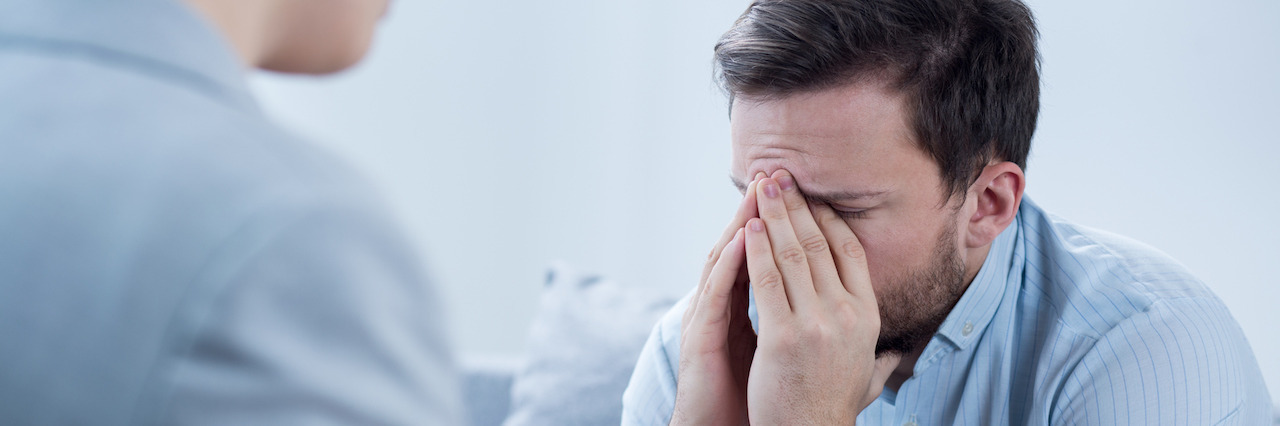 How Group Therapy Helped Me Manage My Depression Man with depression crying during psychotherapy session