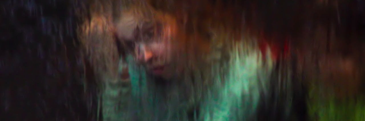 To Anyone Who Has Never Experienced Mental Illness girl sitting with head in hand, rainy effect on colors