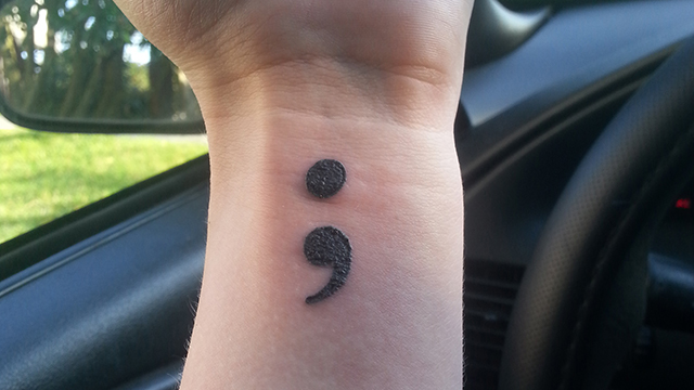 kylee's semicolon tattoo on her wrist