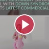 girl with down syndrome in kmart commercial behind red video play button
