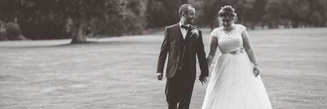 A Letter to the Husband Who Loves Me Through Anxiety and Depression a married couple walking holding hands