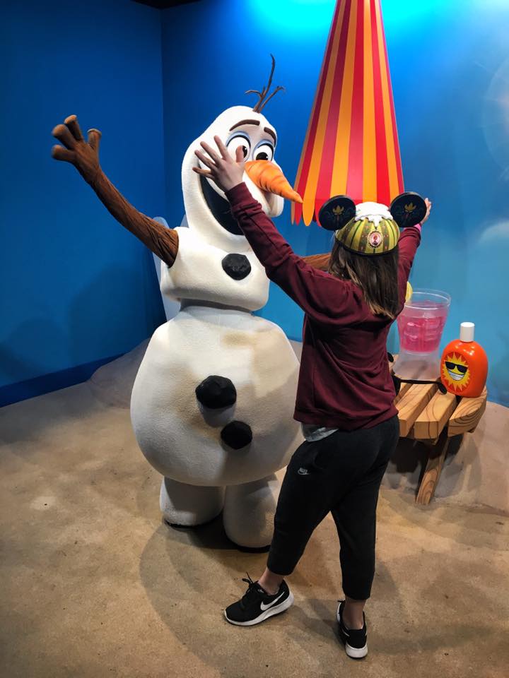 girl hugging olaf