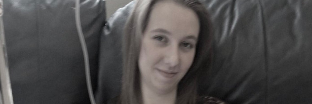 How Lyme Disease 'Ruined' My 'Perfect' Life girl sitting on couch with iv in arm