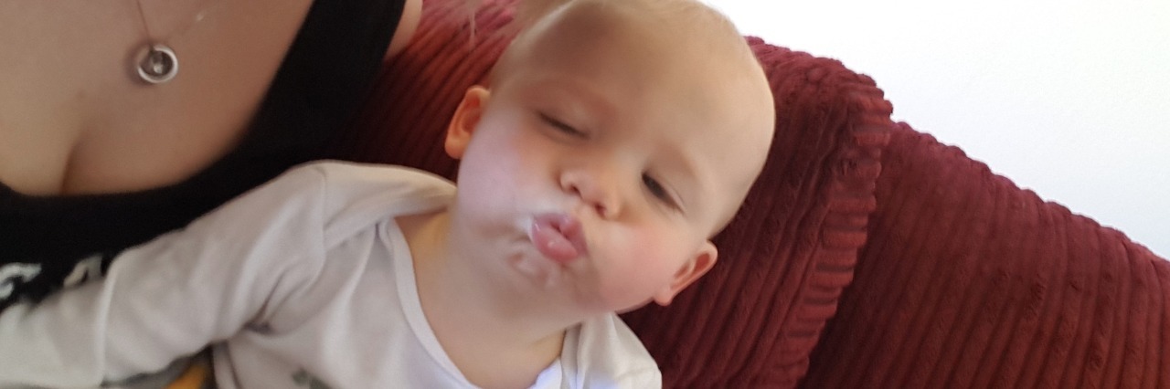 The Reality of Emetophobia: Fear of Vomiting Image of mother with baby pulling faces