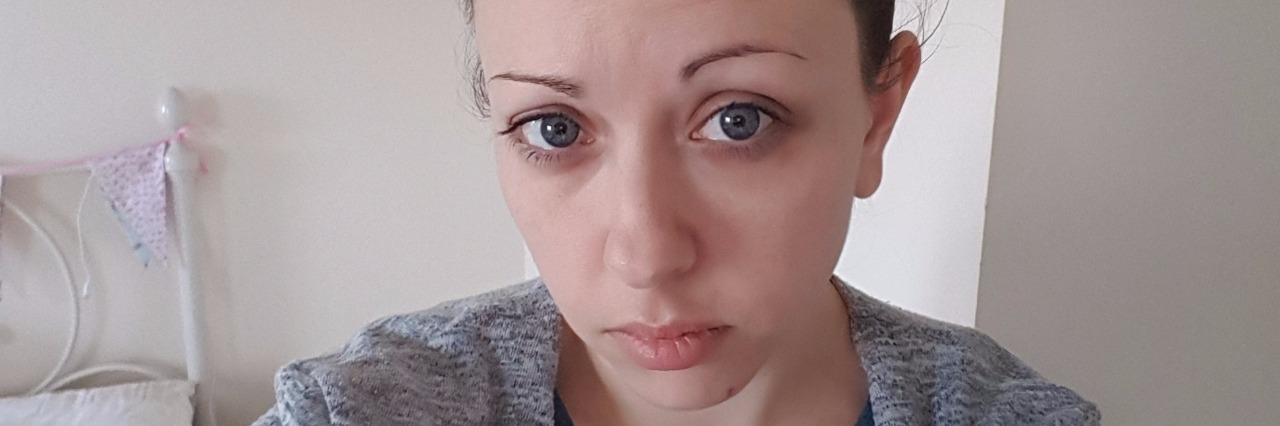 What It's Like Working and Being on Disability for IBD selfie of woman in bedroom