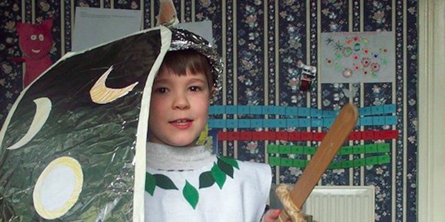 young boy dressed for medieval banquet