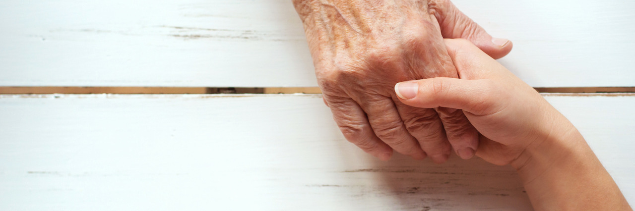 The Power in Saying 'I See You' to a Rape Survivor Two people locking hands across a table