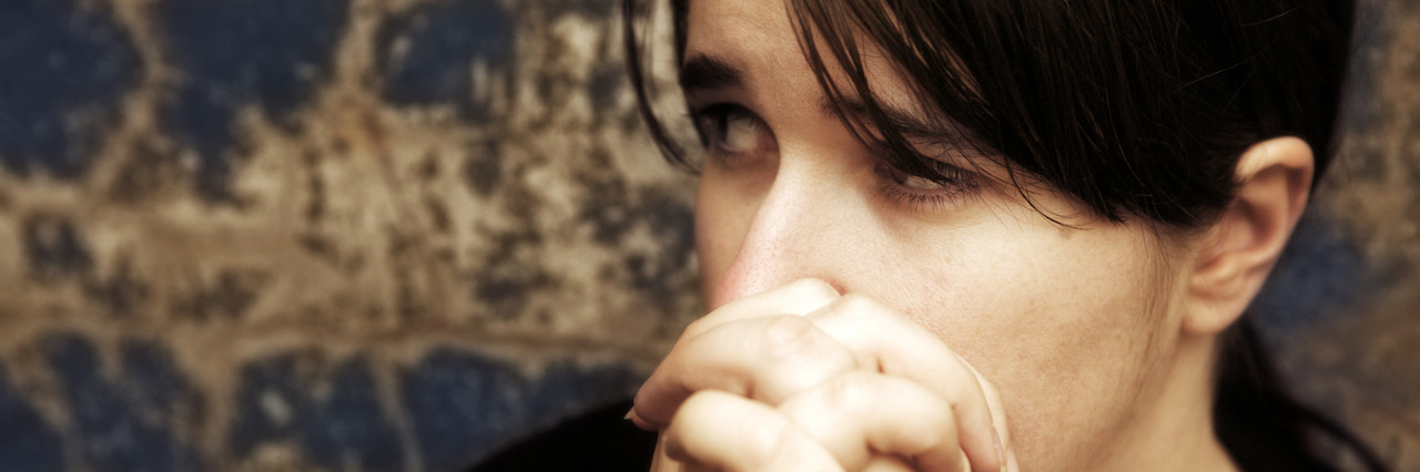 When You Are Afraid to Recover From Depression and Anxiety An anxious woman with her hands clapsed