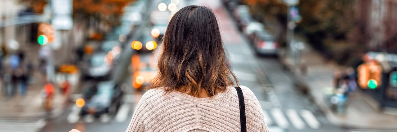 My Chronic Illnesses Make Me Afraid of Dating woman looking at New York City street