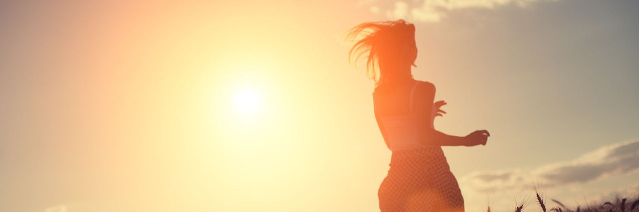 Suicide: The Little Victories When You Are Trying to Survive Blurred girl running in the field at sunset (intentional sun glare and lens flares, lens focus on wheat, girl in blur)
