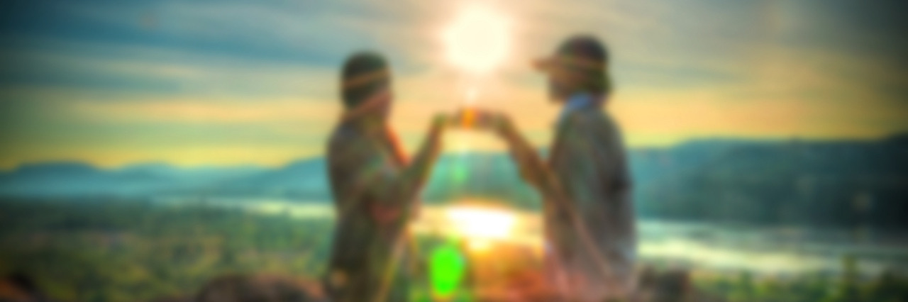 What I Need My 'Person' to Know About My Depression and Anxiety Abstract Blurred and soft photo of the lover standing on the hilltop during sunrise.