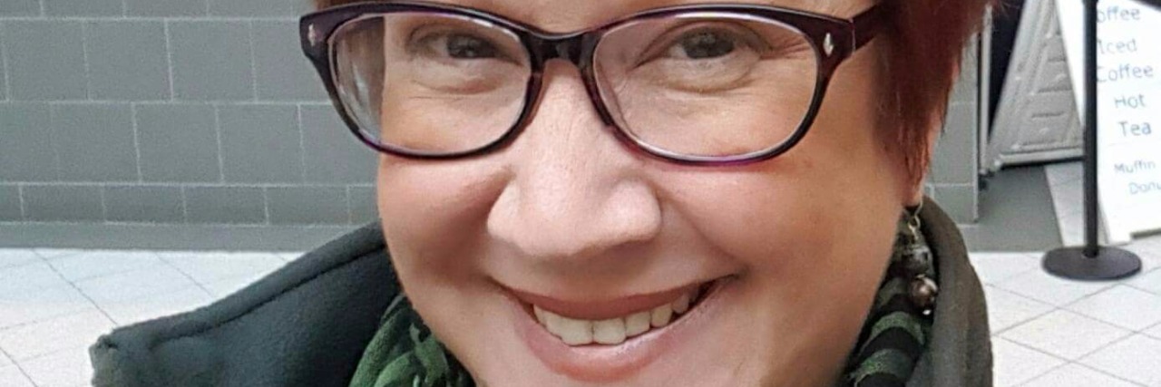 Finding Joy and Persevering Through Your Fight With Lyme Disease woman with red hair and glasses taking a selfie