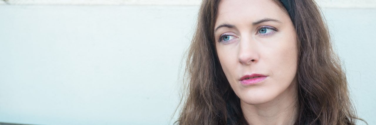 The Crossover of My Adult ADHD, Dyslexia and Dyspraxia Portrait of a young brunette woman looking sad