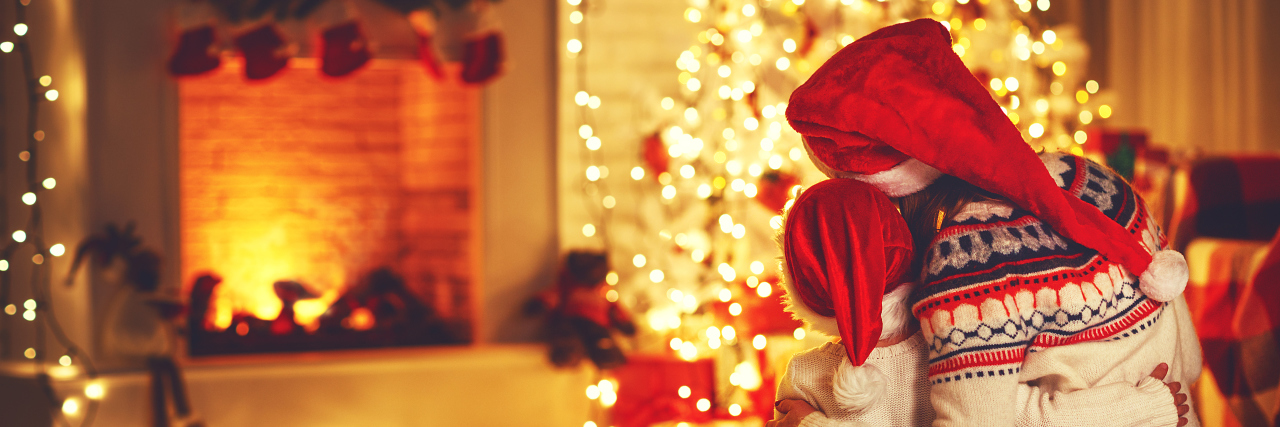 Special Needs Moms Gifts: All I Want for Christmas Is... happy family mother and daughter sitting backs near tree on of Christmas