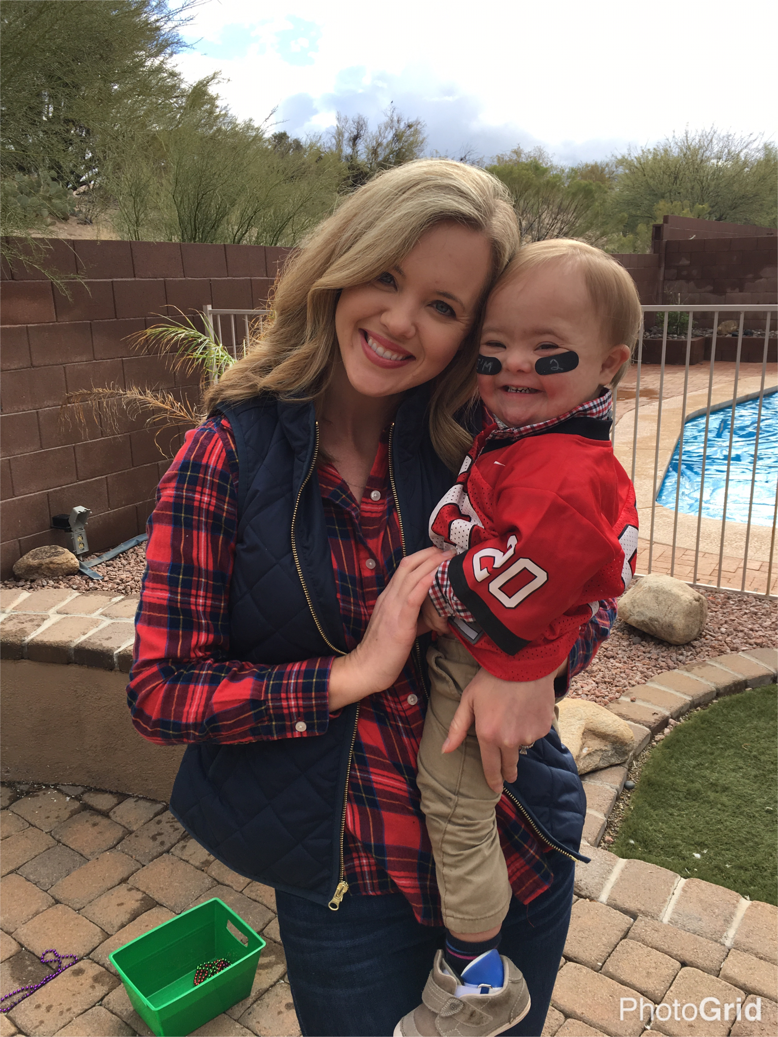 mom holding son with down syndrome on birthday