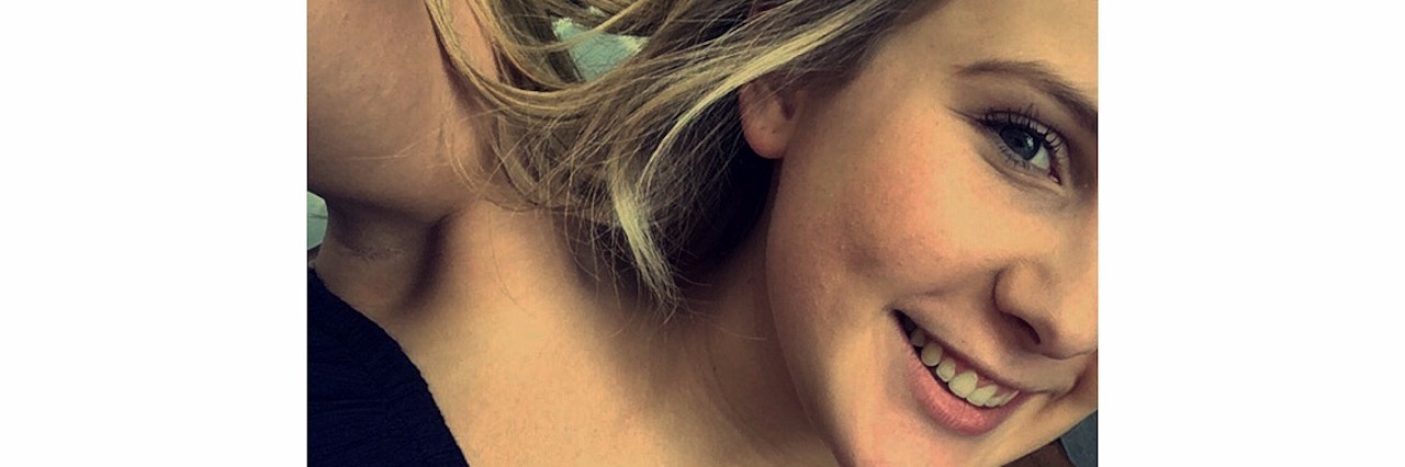 When You're Afraid of Getting a Mental Illness Diagnosis young woman smiling