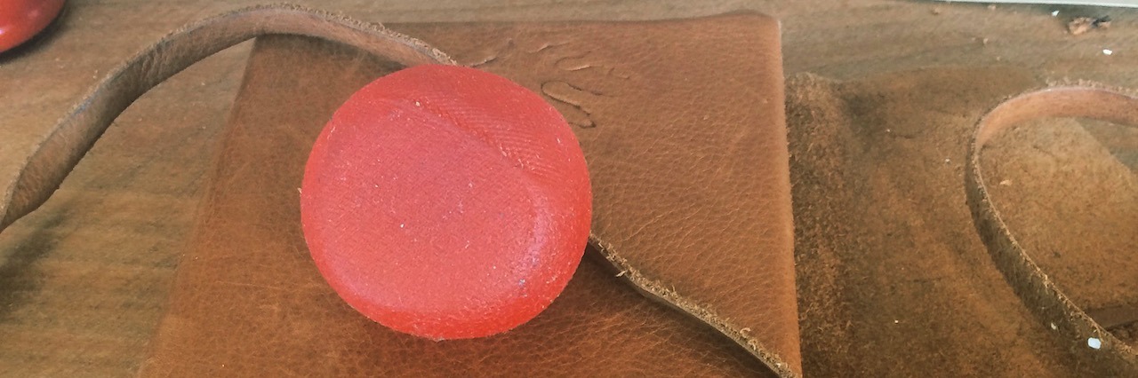 Using New Year's as a Person With a Mental Illness a stress ball sitting on a journal