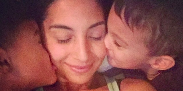 8 New Year’s Resolutions for Preemie Moms twin sons kissing their mothers cheeks from each side