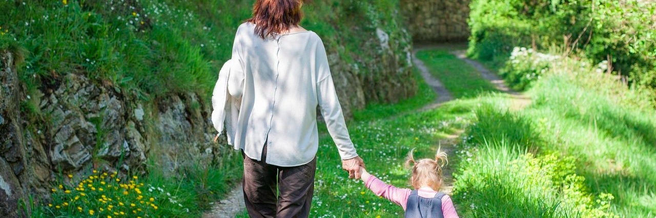 Reasons Why Moms With Chronic Pain Are the Toughest mother and daughter walking in nature