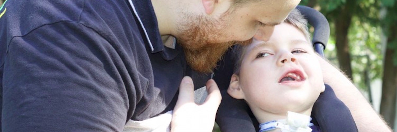 What Raising a Son With a Rare Disease Means to My Family father with arm around son