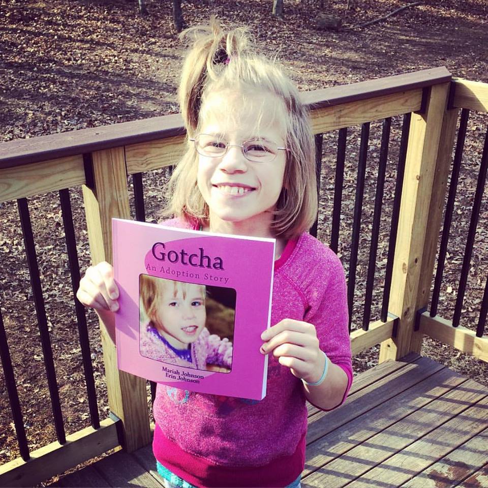 Mariah holding her book.