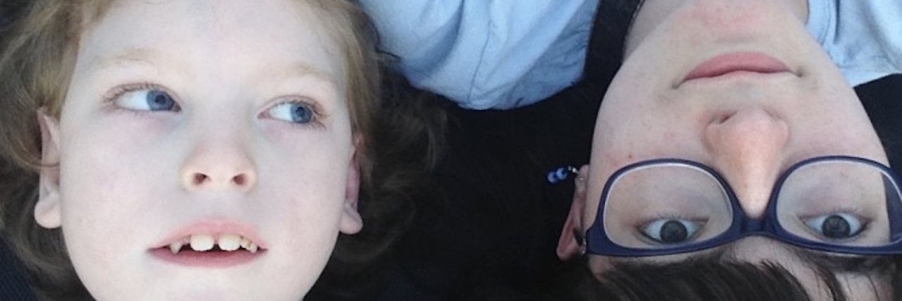 Message for the Next Person Who Googles ‘Vici Syndrome’ woman in glasses posing for photo with her brother