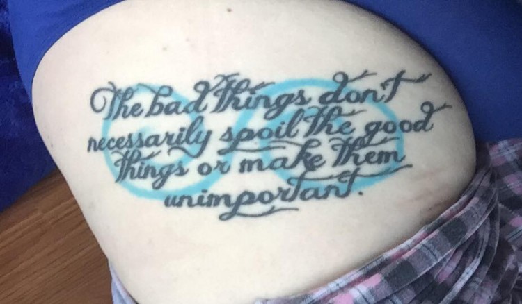 A tattoo with text that says, "the bad things don't necessarily spoil the good things and make them unimportant."