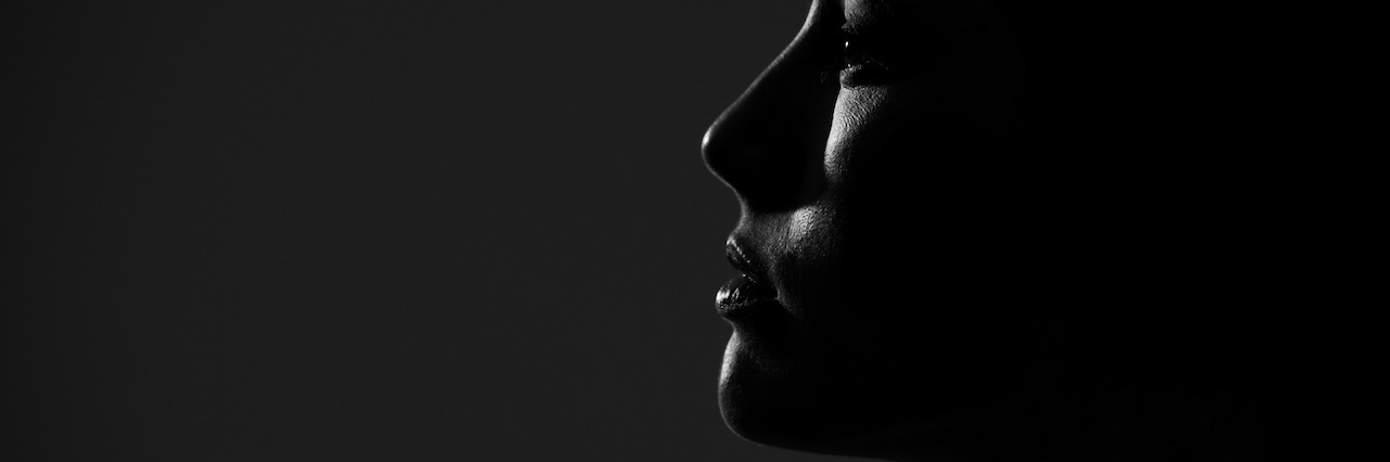 Grief: What I Miss Since the Loss of My Mother A side profile of young pretty woman looking away. Profile view.