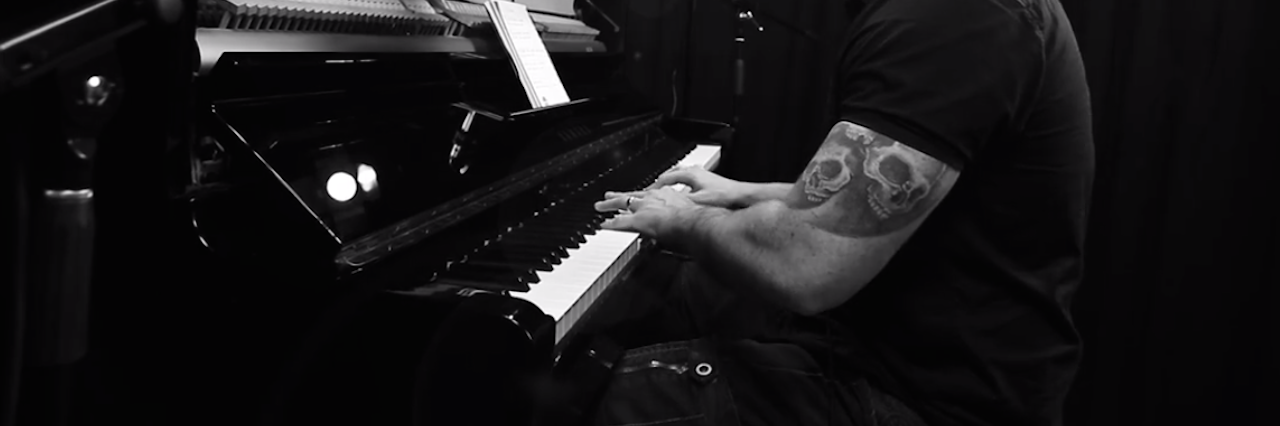 Mike Logan Stubbs Shares Story Behind Depression Song The author playing piano