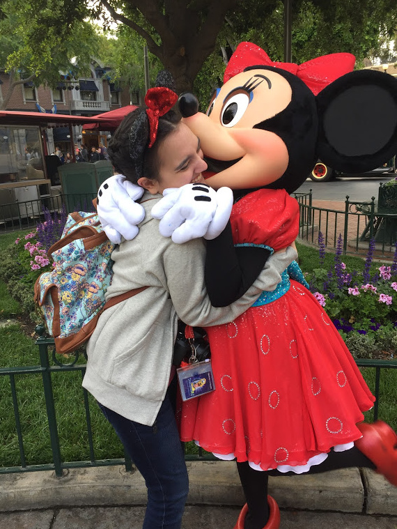 The author hugging Minnie Mouse at Disneyland