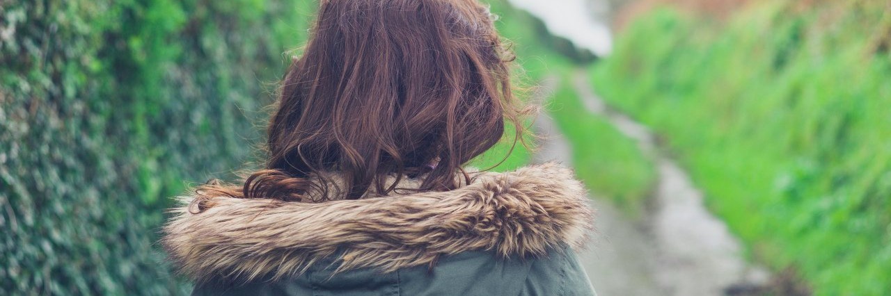 Lyme Disease: It’s Time for Me to Stop Joking About My Illness woman walking on country road