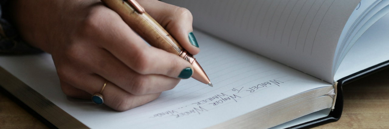 Am I Surviving Mental Illness? person writing in journal