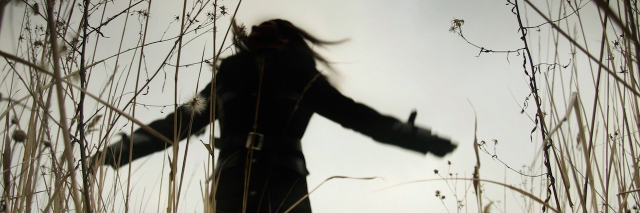 What Anxiety Looks Like in My Dream sillouette of a woman running through a field