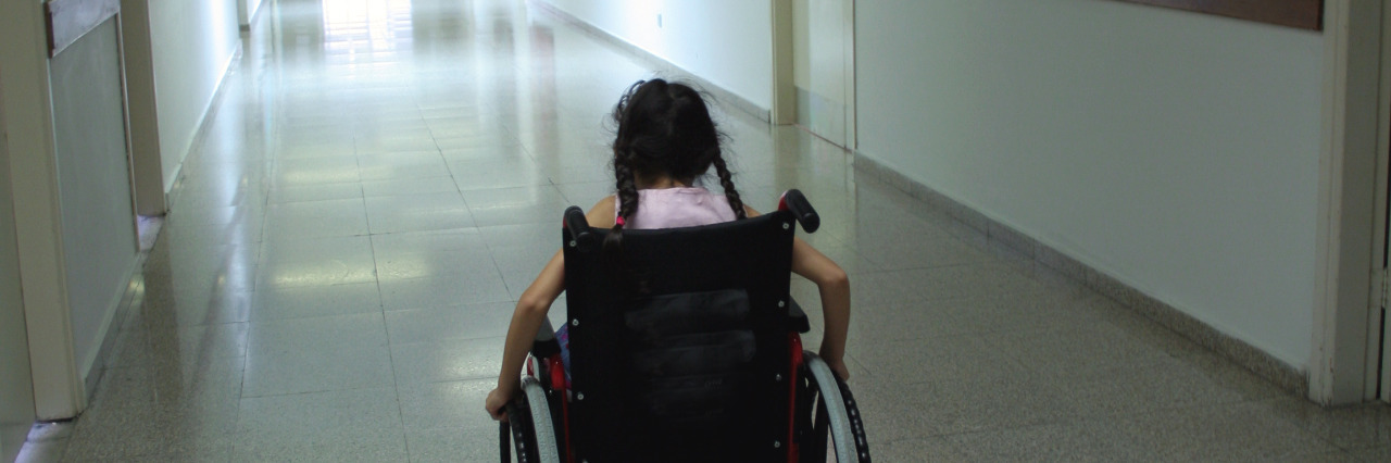 School Excludes Disabled Students From Disability Awareness Planning Girl in school hallway.