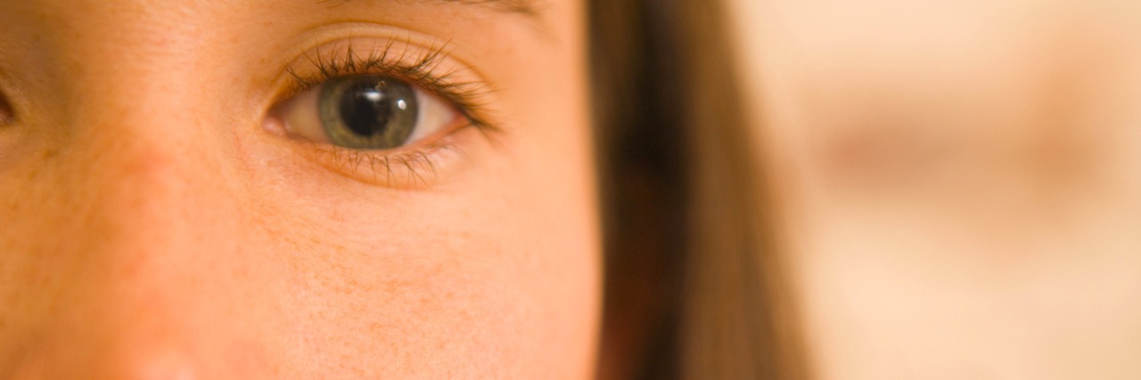 Living With a Mental Illness and 'Gaslighting' A close up of a woman's face