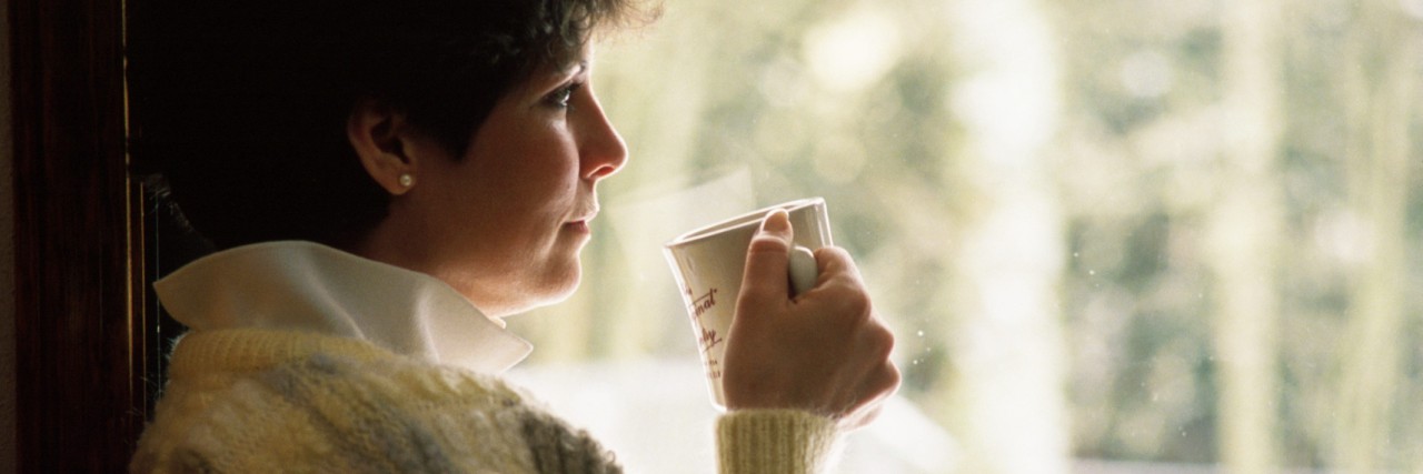 Dealing With Raynaud's in the Winter woman drinking Winter Tea