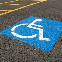 Low-angle close-up of a handicapped parking space