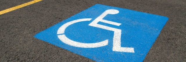 Low-angle close-up of a handicapped parking space