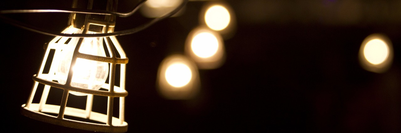 Fighting the Darkness of Depression by Looking for the Light Glowing lamps hanging outdoors.