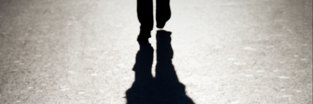 Depression Feels Like a 'Shadow' You Can't Escape The shadow of a person walking.