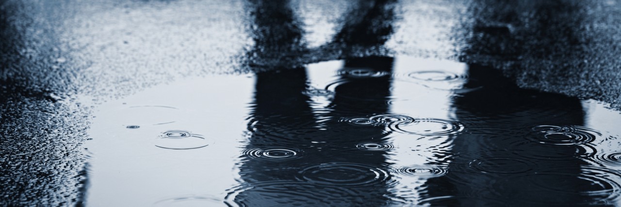 When a Stranger Calmed My Anxiety in the Middle of a Panic Attack People standing in rain