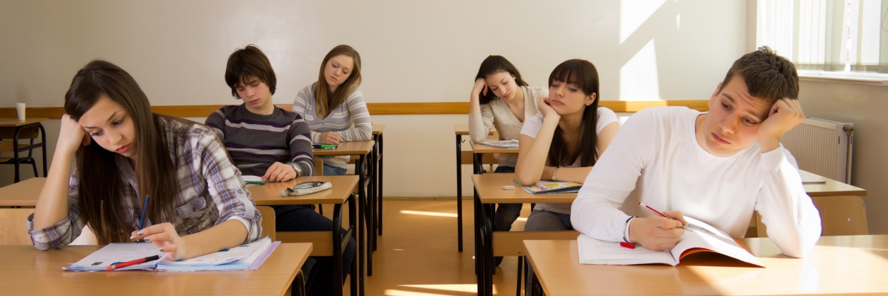 When My Anxiety Got the Best of Me During My Exam High-school students bored in a classroom, during lesson.