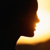 Silhouette of woman, close-up.